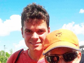 Petrolia teen Matt Mueller poses for a photo with Canadian tennis star Milos Raonic at the Rogers Cup in Toronto this week. The 14-year-old delivered a thank you card to Raonic who donated $6,500 to help repair the Petrolia tennis courts last summer. (Handout)