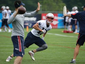 Patriots wide receiver Chris Hogan (centre) runs out for a pass during a practice in Foxborough, Mass., on Tuesday, June 7, 2016. (Steven Senne/AP Photo)