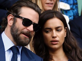 In this July 10, 2016, file photo, actor Bradley Cooper, left, speaks with his girlfriend model Irina Shayk on the fourteenth day of the Wimbledon Tennis Championships in London. Cooper and Shayk were spotted by TV cameras at the 2016 Democratic National Convention in Philadelphia Wednesday, July 28, 2016. His appearance has drawn ire among conservative fans of his 2014 hit, "American Sniper." (AP Photo/Kirsty Wigglesworth, File)