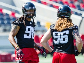 Redblacks defensive end Paul Hazel (left). (Errol McGihon/Ottawa Sun)