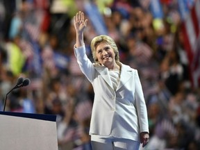 Democratic presidential nominee Hillary Clinton waves on stage during the fourth and final night of the Democratic National Convention at Wells Fargo Center on July 28, 2016 in Philadelphia, Pennsylvania. / AFP PHOTO / Nicholas KammNICHOLAS KAMM/AFP/Getty Images