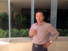 In this Thursday, April 21, 2016 file photo, Hyongtae Pae stands outside the federal courthouse in Honolulu, after pleading guilty to interfering with a flight crew. Pae, a Korean tourist who was arrested after he became violent when he wasn't allowed to do yoga on a plane leaving Hawaii won't get additional jail time. But he must pay United Airlines more than $44,000. A federal judge in Honolulu on Thursday, July 28, 2016, sentenced Pae to time served, which was about 13 days. He'll be under court supervision for three years, which is the amount of time he has to pay the restitution. (AP Photo/Jennifer Sinco Kelleher, File)