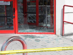 A man forced entry to the Shoppers Drug Mart at 445 Princess St. at approximately 4:40 a.m. in Kingston, Ont. on Friday July 29, 2016. Steph Crosier/Kingston Whig-Standard/Postmedia Network
