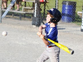 Carson Harmer takes a mighty swing during recent Major Rookie baseball action. The Tier 1 team posted an unbeaten regular season mark and look to continue their winning ways this weekend on their home field in the WOBA playoff tournament. ANDY BADER/MITCHELL ADVOCATE