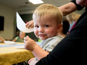 Brendan Sherwood, 1, enjoys his brownies during the Teddy Bear Tea Party at the Spruce Grove Public Library on Thursday, July 21, 2016. The Teddy Bear Tea Party was part of the Summer Reading Program’s Wild Event, hosted every Thursday at the library at 2 p.m.  - Photo by Yasmin Mayne