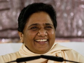 In this Sept. 22, 2015 file photo, India's Bahujan Samaj Party (BSP) chief Mayawati smiles as she addresses journalists at a press conference in New Delhi, India. (AP Photo/Saurabh Das, File)