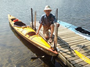 Ralph Wirsig demonstrates how his invention, the KayaArm, creates a stable platform for getting in and out of a kayak at his home on Buck Lake north of Kingston, Ont. on Friday, July 7, 2016. Elliot Ferguson/The Whig-Standard/Postmedia Network