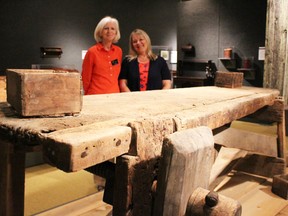 Assistant curator Fran Nichol and curator Lois Gilmou, of the Lambton Heritage Museum, are pictured here with the workbench of early Lambton carpenter John McElroy. The museum is currently hosting the Made in Lambton carpentry exhibit. Barbara Simpson/Sarnia Observer/Postmedia Network