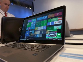 In this April 29, 2015, file photo, a Dell laptop computer running Windows 10 is on display at the Microsoft Build conference in San Francisco. (AP Photo/Jeff Chiu, File)