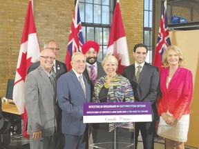 Gerry Marshall, left, Chatham-Kent Mayor Randy Hope, Ontario Infrastructure Minister Bob Chiarelli, federal Minister of Science, Innovation and Economic Development Navdeep Bains, Ontario Deputy Premier Deb Matthews, London North Centre MP Peter Fragiskatos, and London West MP Kate Young were among the politicians present at an announcement this week in London for a program to extend high speed Internet in rural Southwestern Ontario. Columnist Larry Cornies compares it to the creation of Highway 401. (HANK DANISZEWSKI, The London Free Press)