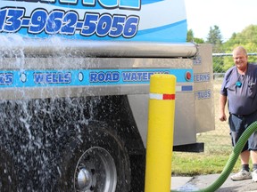 Samantha Reed/The Intelligencer
Gene Rosebush, owner of Ross Pound Bulk Water Service, refills his truck before his ninth and final appointment of the day. Rosebush has been delivering water to empty wells all over the area because of the drought. Business has been so busy that he's had to bring in his daughter Amanda for extra help.