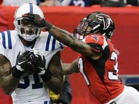 Indianapolis Colts wide receiver Andre Johnson (81) catches a pass against Atlanta Falcons safety Ricardo Allen (37) Sunday, Nov. 22, 2015, in Atlanta. (AP Photo/David Goldman)