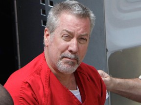 In this May 8, 2009, file photo, former Bolingbrook, Ill., police officer Drew Peterson arrives for court in Joliet, Ill. On Tuesday, May 31, 2016, jurors in Chester, Ill., found Peterson guilty of trying to hire someone to kill the prosecutor who helped convict him in his third wife's death. (AP Photo/M. Spencer Green, File)