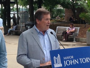 Mayor John Tory announcing a pilot project that will let people buy ferry tickets with an app (Shawn Jeffords/Toronto Sun/Postmedia Network)