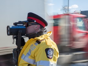 Constable Jeff Sliwa hunts for speeders along Scona Road in Edmonton on Thursday, March 13, 2014.