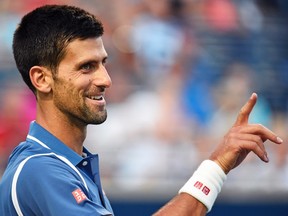 Novak Djokovic, of Serbia, reacts as he plays Tomas Berdych, of the Czech Republic, during men's quarter-final Rogers Cup action in Toronto on July 29, 2016. (THE CANADIAN PRESS/Nathan Denette)