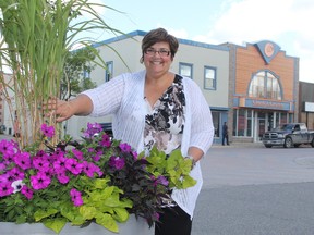 Noella Rinaldo, executive director of the Downtown Timmins BIA, says the association is launching an initiative to help fill some of the vacant buildings in the city’s main core, including the two seen here directly behind her.
RON GRECH/The Daily Press