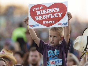 A young fan shows his appreciation as Dierks Bentley performs on the main stage at Big Valley Jamboree 2016 in Camrose, Alberta on Friday, July 29, 2016.