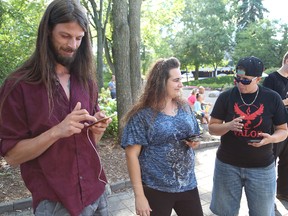 John Lappa/Sudbury Star
Alex Pace, left, Thea Lavorato and Laura Inglis search for Pokemon creatures at Memorial Park this week. The park is the most popular area in town to play Pokemon Go.