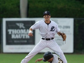 London Majors second baseman Chris McQueen jumps over the top of Kitchener Panthers batter Tanner Nivins after tagging the runner out at second base before completing the double play during their Intercounty Baseball League game at Labatt Park in London, Ont. on Friday July 29, 2016. Craig Glover/The London Free Press/Postmedia Network
