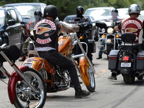 Members of the Hells Angels ride outside the Hells Angels Nomads compound during the group's Canada Run event in Carlsbad Springs, Ont., near Ottawa, on Saturday, July 23, 2016. THE CANADIAN PRESS/Justin Tang