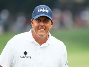 Phil Mickelson smiles on the 18th green during the third round of the PGA Championship at Baltusrol Golf Club in Springfield, N.J., on Saturday, July 30, 2016. (Andrew Redington/Getty Images)