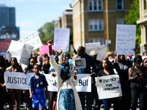 Demonstrators march from Somerset Square park to Ottawa Police headquarter on Elgin street during the March for Justice - In Memory of Abdirahman Abdi. Saturday, July 30, 2016.