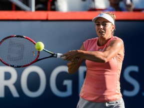 Kristina Kucova of Slovakia hits a return to her opponent Madison Keys of the United States during their Rogers Cup semifinal match in Montreal on Saturday, July 30, 2016. (Minas Panagiotakis/Getty Images)