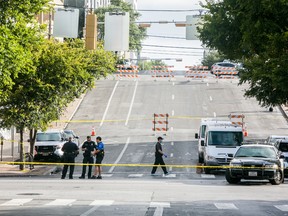 Police block off an area of 6th Street after two shootings July 31, 2016 in downtown Austin, Texas. Austin Police say shots rang out in the city's entertainment district around 2:17 a.m. A woman in her 20s was killed and three women in their 30s were listed in serious but non-life threatening condition, according to published reports.  (Photo by Drew Anthony Smith/Getty Images)