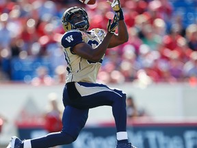 Winnipeg Blue Bombers Clarence Denmark with a touchdown catch against the Calgary Stampeders during CFL football in Calgary, Alta. on Saturday July 18, 2015.