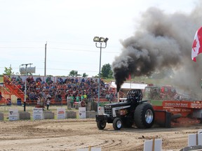 A driver in the modified tractor class hits the track at the Embro Truck and Tractor Pull on Saturday, July 30, 2016. (MEGAN STACEY/Sentinel-Review)