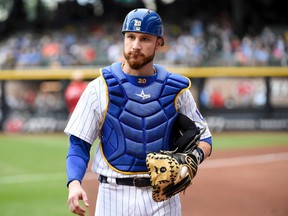 In this July 29, 2016, file photo, Milwaukee Brewers catcher Jonathan Lucroy gets ready before a baseball game against the Pittsburgh Pirates in Milwaukee. (AP Photo/Benny Sieu, File)