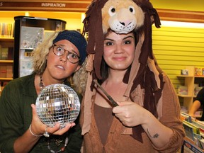 Rachel Colquhoun, 31, and her sister Naomi Colquhoun, 29, get into the spirit of the Harry Potter world at a book launch party held Saturday night. Dozens of 'Potterheads' packed Sarnia's The Book Keeper for the midnight release of "Harry Potter & The Cursed Child," the eighth book in the wildly popular franchise. Barbara Simpson/Sarnia Observer/Postmedia Network