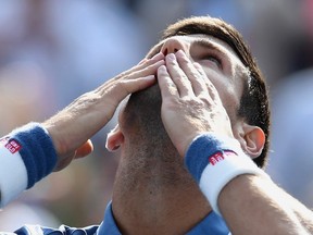 Novak Djokovic of Serbia celebrates his win over Kei Nishikori of Japan during men's Rogers Cup final tennis action the Aviva Centre in Toronto on July 31, 2016. (THE CANADIAN PRESS/Frank Gunn)