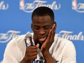 Draymond Green of the Golden State Warriors speaks to members of the media after being defeated by the Cleveland Cavaliers in Game 7 of the NBA Finals at ORACLE Arena in Oakland on June 19, 2016. (Thearon W. Henderson/Getty Images/AFP)