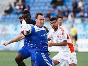 Edmonton's Albert Watson defends against Carolina's Aly Alberto Hassan during NASL soccer action between FC Edmonton and the Carolina RailHawks at Clarke Stadium in Edmonton, Alta., on Sunday, July 31, 2016.