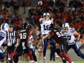 Argos' Logan Kilgore lets go with a pass under pressure during last night's win over Ottawa. (CP)