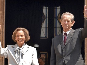 In this Thursday, June 5, 2008 file photo, former Romanian King Michael I, right, and his wife Ana, left, wave from the balcony of the Peles Castle, in Sinaia, Romania. Romania’s royal house says Anne of Romania, the wife of Romania’s last monarch, King Michael, has died. She was 92. A statement said Anne died Monday, Aug. 1, 2016 at a hospital in Morges, Switzerland, surrounded by family. (AP Photo/Paul Buciuta, File)