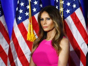 This file photo taken on June 06, 2016 shows Melania Trump, wife of Republican presidential candidate Donald Trump, listening as her husband delivers remarks at Trump National Golf Club Westchester in Briarcliff Manor, New York. The New York Post on August 1, 2016 ran a front-page picture of potential first lady Melania Trump naked, prompting criticism on social media and charges of misogyny. It was the second day in a row that the Rupert Murdoch-owned tabloid ran a front page nude image of Republican presidential candidate Donald Trump's wife from her years as a young model. (KENA BETANCURKENA BETANCUR/AFP/Getty Images)