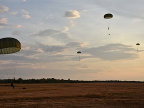 Cadets taking part in the Canadian Forces Basic Parachutist course land at a drop zone following one of their several jumps last week. 
Photo by FSgt. Alex Galoustian