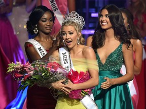 Miss Texas Teen USA 2016 Karlie Hay (C) reacts as Miss USA 2016 Deshauna Barber (L) and Miss Teen USA 2015 Katherine Haik (R) crown Hay Miss Teen USA 2016 during the 2016 Miss Teen USA Competition at The Venetian Las Vegas on July 30, 2016 in Las Vegas.  (Photo by Ethan Miller/Getty Images)