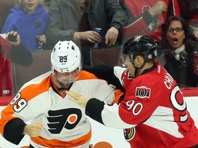 Ottawa Senators’ Alex Chiasson (right) fights with Sam Gagner during NHL action in Ottawa, on Saturday, Nov. 21, 2015. (THE CANADIAN PRESS/Fred Chartrand)