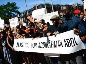 Demonstrators shout and chant for justice as they arrive at Ottawa Police headquarter during the March for Justice - In Memory of Abdirahman Abdi. Saturday, July 30, 2016. (James Park, Postmedia Network)