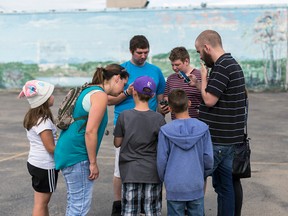 Whitecourt Pokémon GO Team Valour work together to "take the gym", by battling the other teams Pokémon in order to claim the gym on July 21. Hannah Lawson | Whitecourt Star