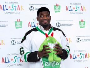 Nashville Predators defenceman P.K. Subban hams it up with a stuffed mascot during a news conference in advance of the P.K. Subban All-Star Comedy Gala, Monday, Aug. 1, 2016, in Montreal. (THE CANADIAN PRESS/Paul Chiasson)