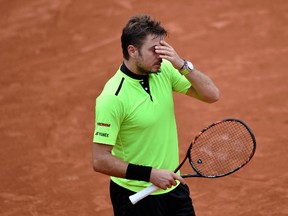 World number four Stan Wawrinka withdrew from the Rio Olympics with a back injury on August 02, 2016, dealing another body blow to the tennis tournament which has been hit by a series of high-profile pull-outs. (PHILIPPE LOPEZ/AFP/Getty Images)