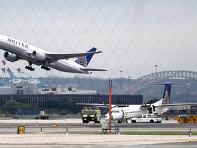 In this July 25, 2013, file photo, a United Airlines plane takes off from Newark Liberty International Airport, in Newark, N.J. (AP Photo/Julio Cortez, File)