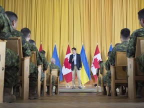 Canadian Prime Minister Justin Trudeau speaks to Canadian troops as he visits the International Peacekeeping and Security Centre near Yavoriv, Ukraine Tuesday July 12, 2016.