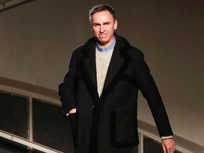 (FILES) This file photo taken on January 20, 2016 shows Belgian designer Raf Simons acknowledging the crowd at the end of his fashion show during the men's Fashion Week for the 2016-2017 Fall/Winter collection in Paris. Former Christian Dior designer Raf Simons has been appointed Calvin Klein chief creative officer and will debut his first collections for the fall 2017 season, the US fashion house announced August 2, 2016.
