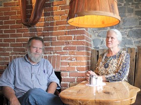 Isaac and Joy Dawson, leaders of the Twelve Tribes community on their farm in Kingston, sit in their "Yellow Deli" on Princess Street in Kingston, Ont. on Tuesday August 2, 2016. (Victoria Gibson/For The Whig-Standard)